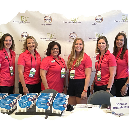 Women writing on white board