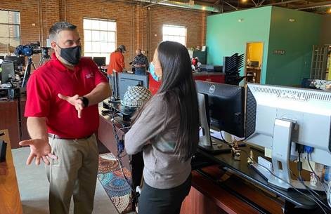 Rep. Sharice Davids speaks with Cherub Medical Supply Director of Operations Sam Cress.